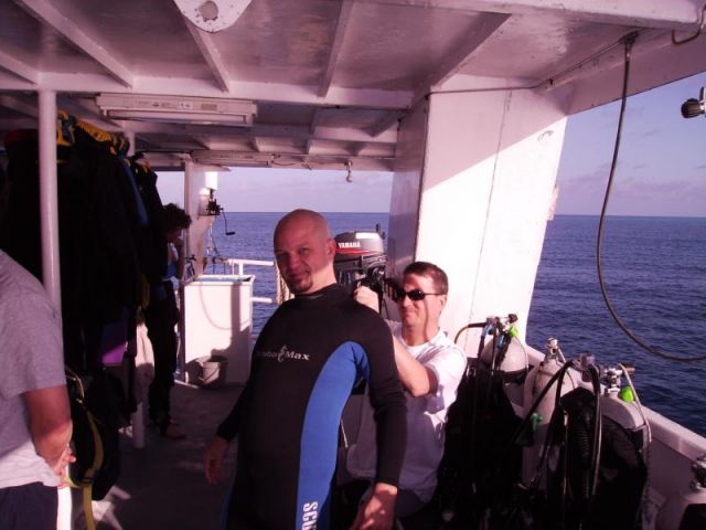 Tom helping Squid with his wetsuit