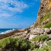 cayman brac rocky beach combing 1060x403 Min