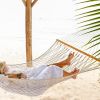 cayman brac couple In beach hammock 1060x403 Min